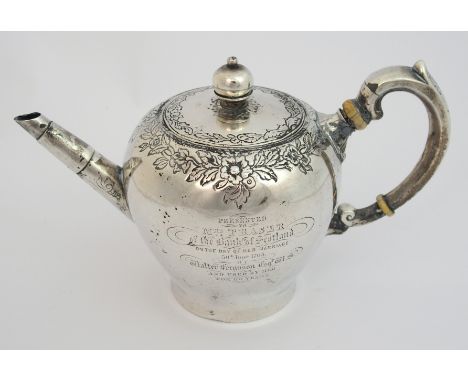An early George I silver teapot probably by John Mettlesone, Edinburgh 1717, of bullet shape with foliate engraved border, th