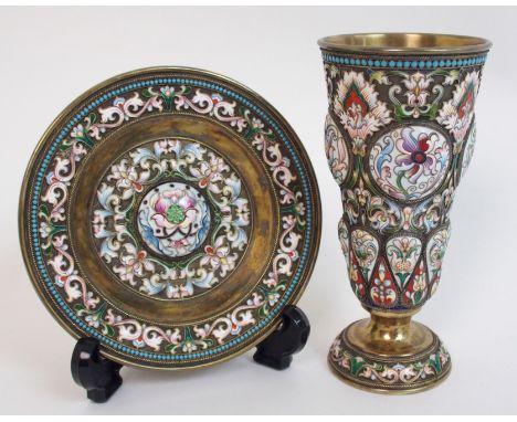 A Russian silver and enamel goblet of tapering cylindrical form on convex pedestal base, decorated with raised circular and i