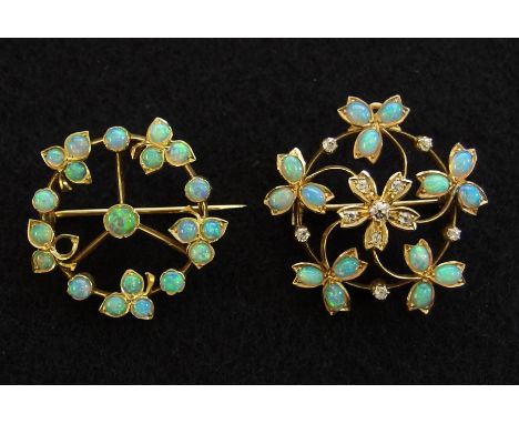 An opal and diamond Edwardian pendant brooch set with old brilliant cut diamonds to the leaf and flower design, with a loop t