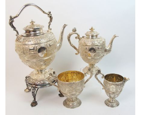 An impressive Victorian three piece silver tea service by D C Rait & Sons, Goldsmiths to the Queen, Glasgow 1875, comprising;