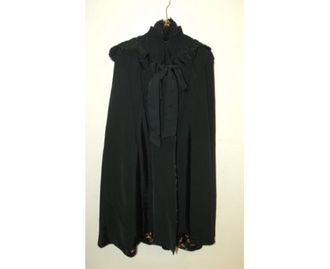 A Victorian 3/4 length black cape with embroidered collar and embroidered floral interior by W R Grieve, Glasgow and a black 