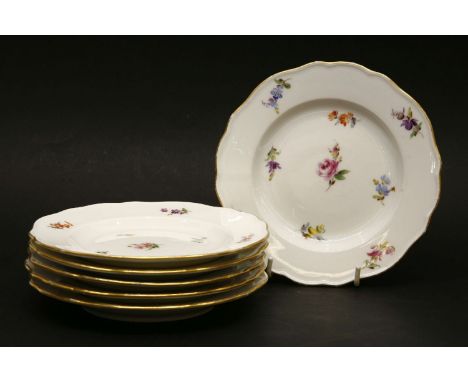 A set of six mid 20th century Meissen plates, decorated with hand painted floral sprays in the Marcolini style