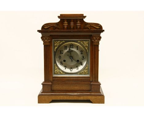 An early 20th century walnut mantel clock, 36cm high