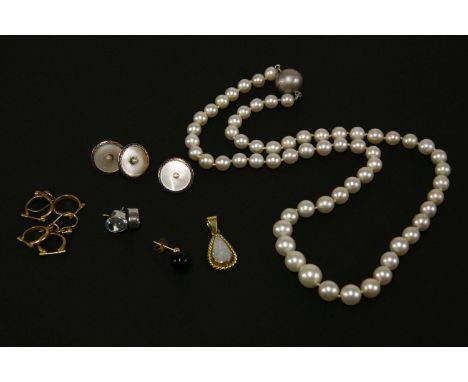 A single row graduating cultured pearl necklace with magnetic clasp, a gold pear shaped cabochon opal pendant (tested as 18ct