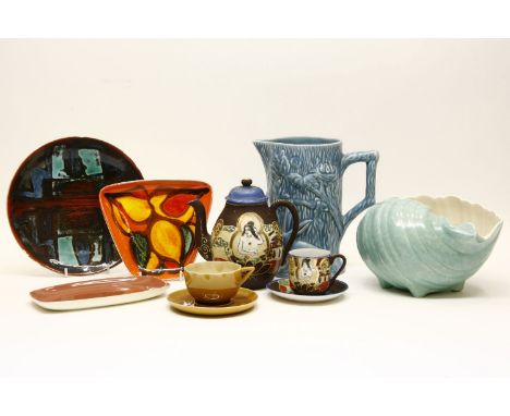 Various items of decorative china and glassware, to include two Poole Delphis dishes, a Poole pottery sea shell, a Wade potte