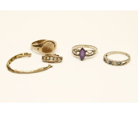 A gold single stone amethyst ring with pierced shoulders (tested as 9ct gold), a 9ct gold blue and white stone half eternity 