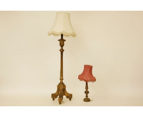 A 20th Century giltwood standard lamp, the fluted column on three outswept feet with husk and greek key detail, H. 165cm, tog