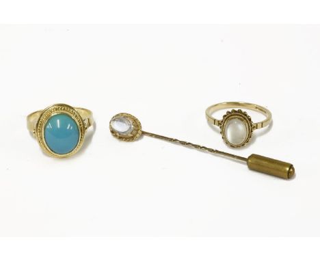 A 9ct gold single stone moonstone ring, and a 9ct gold single moonstone stick pin, and a Continental gold single stone turquo