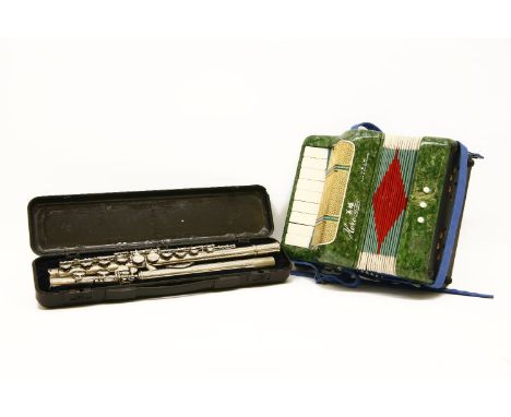 A children's accordion together with a flute, in case