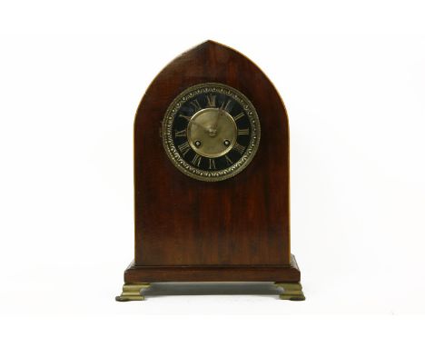 A mahogany cased lancet mantle clock, the movement striking on a gong, the black chapter ring, with Roman numerals, 32cm high