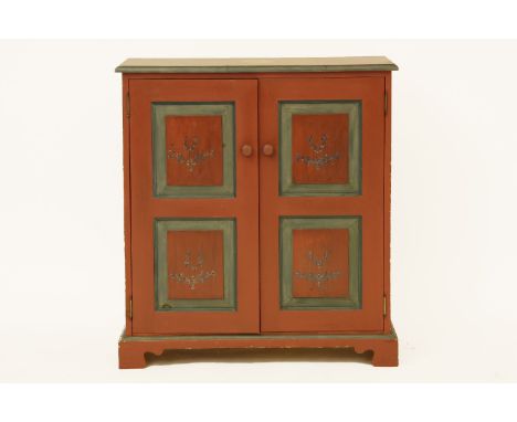 A modern painted two door cabinet, with two panelled doors, the top with a cartouche inscribed 'R.   MCMXCIV', 84cm wide x 91