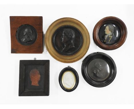 Two miniature wax portrait busts, 16cm high 15.5cm diameter, a plaster bust portrait of Alfred Russell Wallace, a bronzed bus