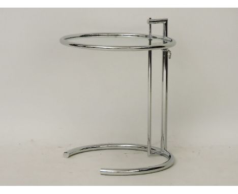 After Eileen Gray, an adjustable table, steel table with a glass shelf