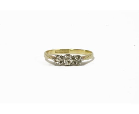 A gold three stone diamond ring, marked 18ct and PT2.00g