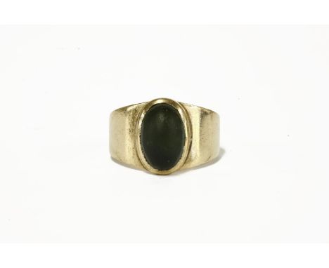 A gold single stone tourmaline cabochon ring (tested as approximately 9ct) c.1960, size N5.54g