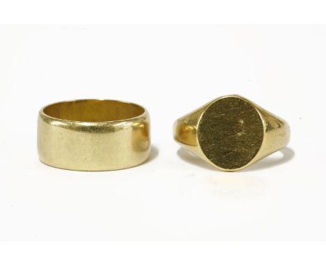 An 18ct gold wedding ring, and an 18ct gold plain signet ringwedding ring 9.64gsignet ring 12.03g