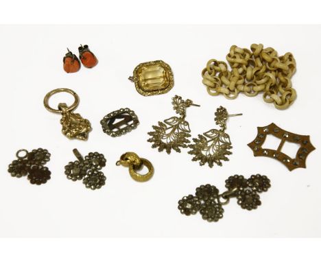 A collection of jewellery to include a gold cased centrepiece, fob and gold split ring, (tested and valued as 9ct gold), a go