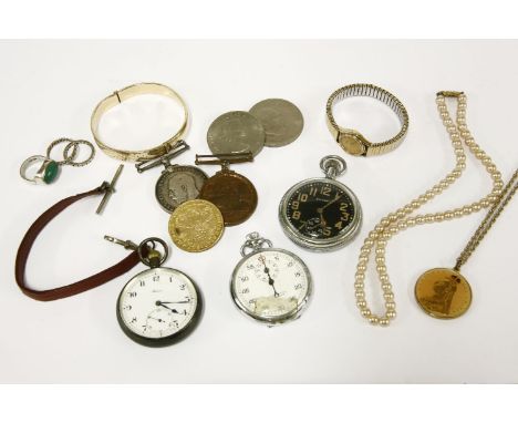 A collection of costume jewellery and medals to include a rolled gold bangle with engraved decoration, a single row simulated