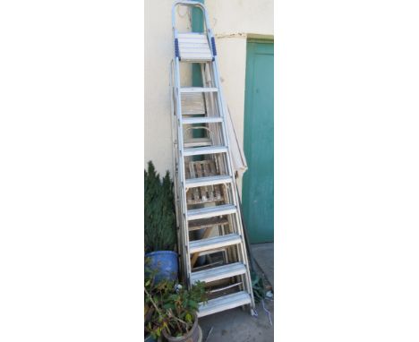 TWO SETS OF ALUMINUM FOLDING LADDERS AND ONE FOLDING WOODEN LADDER