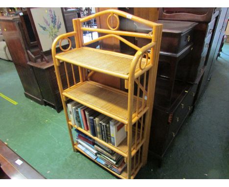 CANE FRAMED OPEN SHELF UNIT, WITH FOUR RATTAN SHELVES *