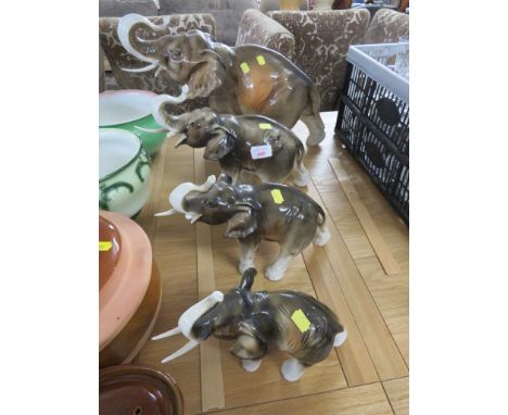 FOUR GRADUATED ROYAL DUX CERAMIC ELEPHANTS (A/F)