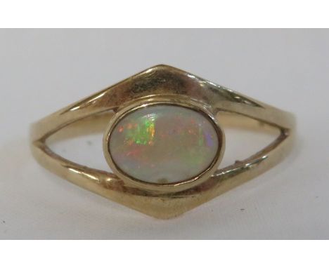 9 carat gold ring set with an opal (7mm x 5mm) in a wishbone setting, British hallmarks, gross weight of ring 1.7g, size P fo