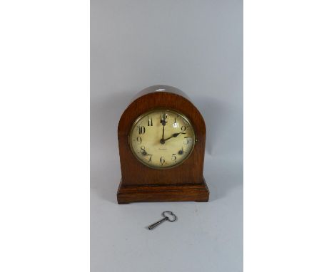 An Edwardian Oak Cased Dome Topped Mantle Clock, the Dial Signed Gilbert, Eight Day Movement, 27cm High 