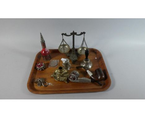 A Tray of Curios to Include Silver Plated Bedchamber Stick, Two Decorated Pipes, Hand Bell, Miniature Balance Scales etc 