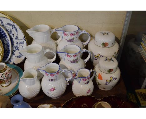 A Set of Four Graduated Coalport Caughley Mask Head Jugs, a Set of Three Graduated Unmarked Examples and Two Graduated Strawb