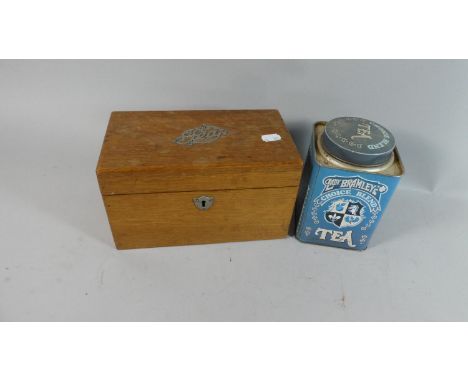 An Edwardian Oak Two Division Tea Caddy and a Tea Tin 