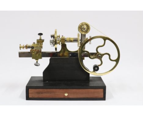 A Brass Swiss Watchmaker's Lathe C.1890. The lathe is brass and steel with ebony handles. All parts are working and moving fr