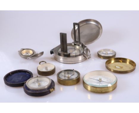 7 vintage compasses inluding a large sighting compass