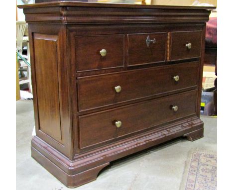 A contemporary reproduction cherry wood commode of two long and three short drawers, moulded surround, fielded panelled sides