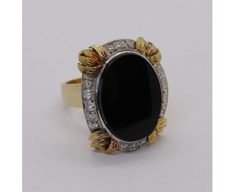 Yellow metal onyx and diamond cocktail ring, size K/L, 13.2g 