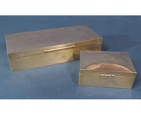 A silver cigar box, 19cm long, Birmingham 1959, by WT Tughill &amp; Co, together with a silver cigarette box (2) 