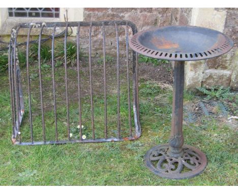 A vintage iron hay manger, a cast iron pedestal bird bath and a planter (3) 