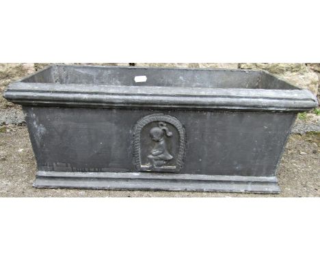 A small lead planter of rectangular form with raised relief detail on three sides of a young girl sat on a potty, 47 cm long 