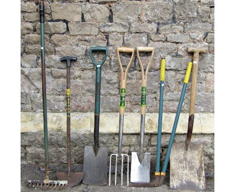 Seven long handled gardening tools 
