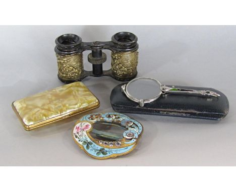 A pair of late 19th century opera glasses with embossed cherub in landscape detail, an enamel and hand painted buckle, a pair