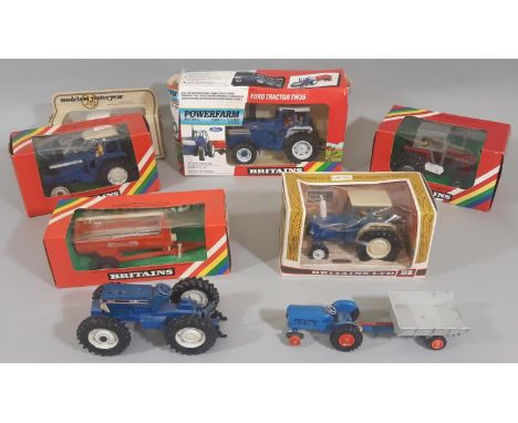 Collection of boxed Britains model tractors including 9321 Ford TW35, 9528 Massey Ferguson, 9523 Ford TW20 and 9524 Ford, tog
