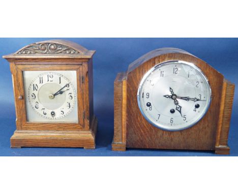 A small oak bracket clock, the case with arched outline, enclosing a single train movement, together with a further art deco 