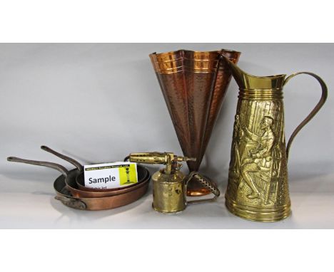 A collection of copper and brassware including a copper umbrella stand, kettle, a brass pitcher, coal scuttle, kettle Middle 