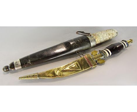 A North African/ Middle Eastern ceremonial gilded curved dagger in a gilded scabbard and a North European hunting knife with 