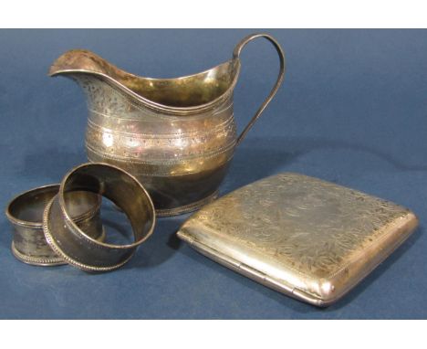 A Georgian silver cream jug, London 1808, by William Bennet, together with a cigarette case and two napkin rings, 7oz approx 