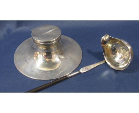 A silver ship's ink well, hallmarks rubbed and an un-hallmarked toddy ladle (2) 