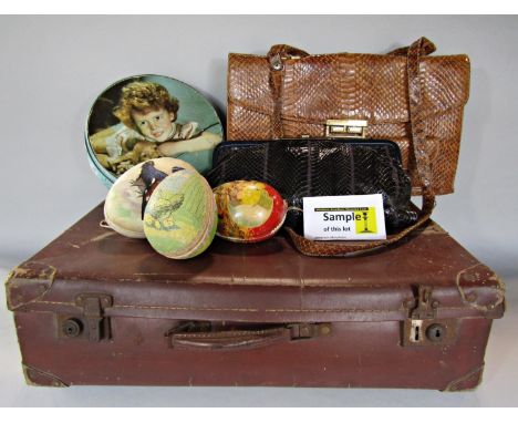 A wicker hamper containing various items, a number of vintage Easter eggs, two snakeskin handbags a distressed leather briefc