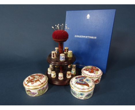 Three Royal Crown Derby trinket boxes and covers from the Butterflies collection of the World series, together with a collect