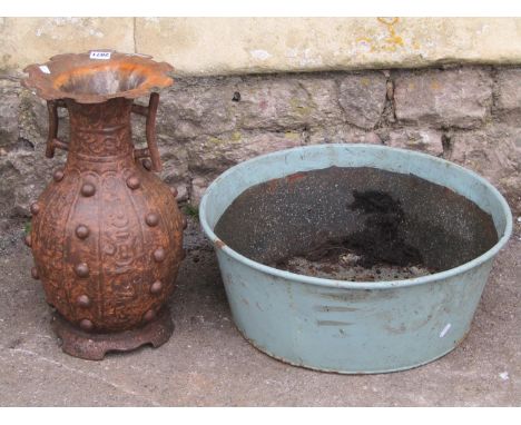 A  modern weathered Chinese archaic style metal vase together with a painted galvanised circular planter (2) 