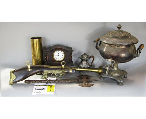 A miscellaneous collection of items, including an electric samovar, tie press, a souvenir blunderbus, a brass shell case, a s