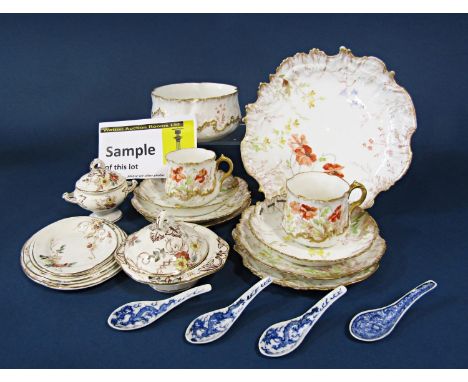 A collection of Limoges teawares with printed poppy decoration and shaped gilded outlines comprising a pair of cake plates, a